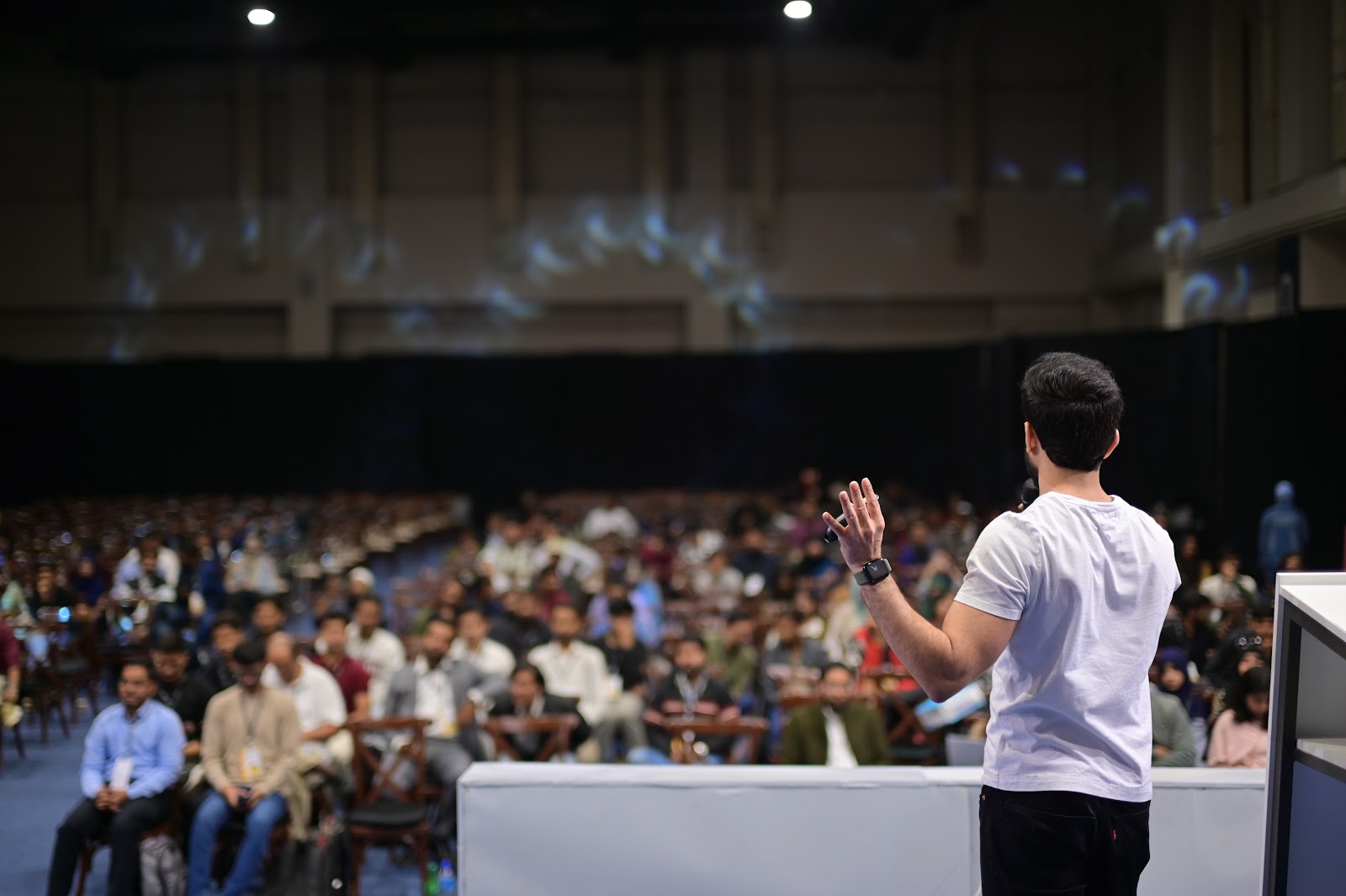 Keynote speaker at a major tech conference highlighting Atompoint leadership